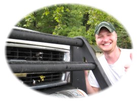 Peter Schillig beside his trophy feathers